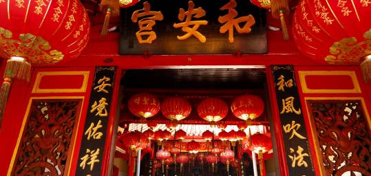 Traditional Chinese temple decorated with red lanterns for Chinese New Year