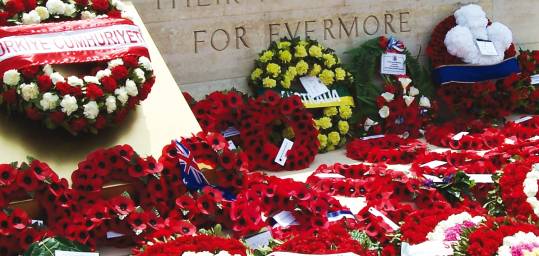 Red poppy wreaths at an ANZAC memorial at ANZAC Cover in Turkey