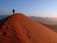 A man walking up a Sossusvlei dune