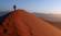 A man walking up a Sossusvlei dune