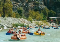 An on the go group having fun,  'tubing' at Saklikent Gorge