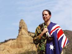 A Bugler at Anzac day, wearing the Australian flag