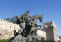 The statue of Saladin sits proudly over the old city in Damascus