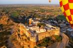 Hot air balloons flying over the temples of Jaipur