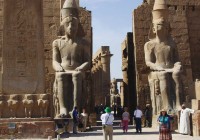 Two colossi and the central corridor of the Luxor Temple on the East Bank of Luxor