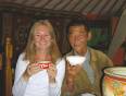 Lady drinking tea with a Mongolian man in a ger tent