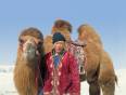 Mongolian man with his camel