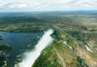 An aerial shot of Victoria Falls and the Zambezi looking towards Zambia