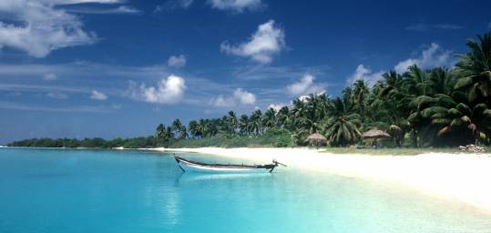 The crystal clear waters and white sands of a Sri Lankan beach