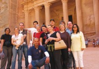 An on the go group outside the rose red Treasury in Petra, Jordan