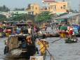 A bustling floating market near Can Tho - by Adam Jones PHD