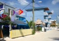 One of Caye Caulker's tranquil sandy streets on a Central America tour.