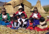 A traditionally dressed family on the floating reed islandsof Uros