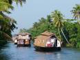 Rice boats on the palm fringed backwaters of Kerala