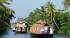 Rice boats on the palm fringed backwaters of Kerala