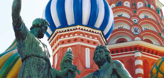 The statue and brightly coloured roof of St Basil's Cathedral in Moscow