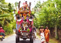 A brightly coloured vehicle, decorated for festival time