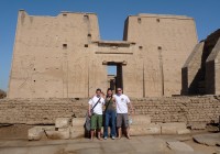 An on the go tours group standing outside the Philae Temple in Egypt