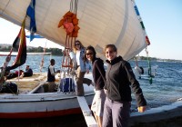 Girls climbing aboard a felucca on the River Nile
