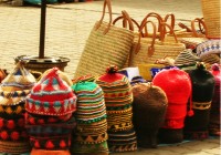 Brightly coloured hand made hats at a local Moroccan market