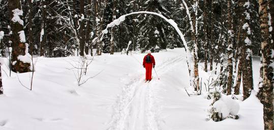 A lady cross country skiing near the shores of Lake Baikal