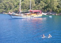 A couple of swimmers enjoy a dip in the Mediterranean Sea