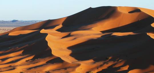 The rolling sand dunes of the Sahara Desert in Morocco