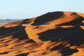 The rolling sand dunes of the Sahara Desert in Morocco