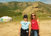 Two girls in Terelj National Park, with a Mongolian Ger in the background