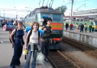 on the go tours passengers with their rucksacks, waiting to board a Trans-Siberian train