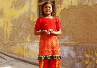 An Indian girl in a bright red sari