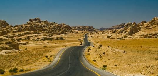 An undulating road through the Jordan landscape