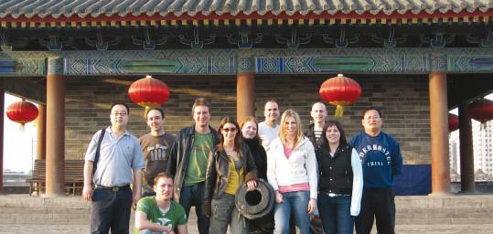 Passengers on one of our China Tours standing by a canon on the medieval Old City Wall in Xi'an
