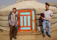 Two Trans-Siberian travellers, standing outside their Ger, in Mongolia
