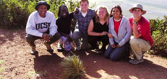 A group pose next to the stunning Ngorongoro Crater - visit here on many of our African Safaris. 