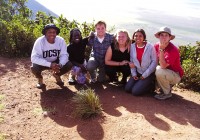 A group pose next to the stunning Ngorongoro Crater - visit here on many of our African Safaris. 