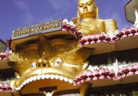 The brightly coloured entrance to the Dambulla caves - an ancient site on our Sri Lanka tours