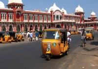 Chennai train station with a fleet of tuk tuks waiting for fares