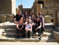 An on the go group sitting by some ancient Egyptian ruins