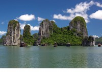 Limestone peaks and boats of UNESCO Listed Halong Bay