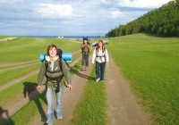 Three Trans-Siberian travellers, walking near the shore of Lake Baikal in Siberia