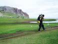 A man walking along the shores of Lake Baikal