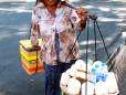 A street trader in Saigon by William Cho