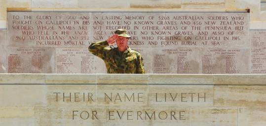 A soldier at an ANZAC memorial on ANZAC Day