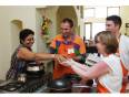 A group learning to cook Indian food at the On the Menu cooking school in Goa