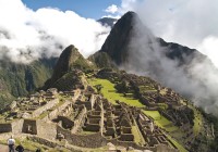2 early risers enjoy the views over Machu Pichu at sunrise before the crowds arrive.