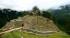 The early morning cloud dissipates to reveal stunning Machu Picchu on our Peru Tours 