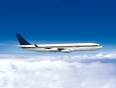 An airplane flying above the clouds