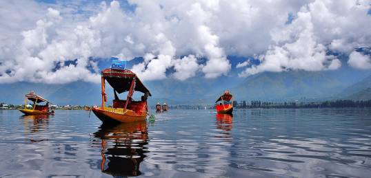 Brightly coloured boats on Dal Lake - photo courtesy of Shahbasharat