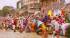 Colourfully dressed people bathing in the Ganges at Varanasi